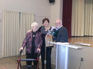 Special presentation for Executive Director Laura Suchan, centre, for her 25 years with the Oshawa Community Museum.  Past President Isabelle Hume, left, and Current President Merle Cole, right. 