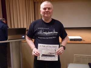 Ian Kinder with a copy of his book, A Tale of Two Sisters
